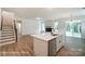 Open-concept living area connects the kitchen to the living room and showcases wood floors and a modern fireplace at 2228 Tabor Rd # 569, Sherrills Ford, NC 28673