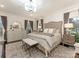 Serene main bedroom featuring a plush bed, elegant decor, and ample natural light at 2326 Lathrop Ln, Charlotte, NC 28211