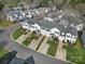 An aerial shot showcases the townhome community's layout, landscaping, and location at 2399 Woodridge Dr, Fort Mill, SC 29715