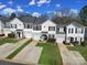 Aerial shot of townhomes featuring well-kept front lawns and convenient driveway access at 2399 Woodridge Dr, Fort Mill, SC 29715