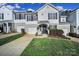 Charming two-story home with well-manicured lawn and inviting front porch at 2399 Woodridge Dr, Fort Mill, SC 29715