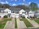 An aerial shot of inviting townhomes, each with a private driveway and a well-manicured lawn, exuding curb appeal at 2399 Woodridge Dr, Fort Mill, SC 29715