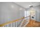 Hallway with hardwood floors and access to laundry room at 2399 Woodridge Dr, Fort Mill, SC 29715