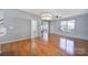 Open living space featuring hardwood floors with seamless flow into other areas at 2399 Woodridge Dr, Fort Mill, SC 29715