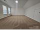 Spacious bedroom with neutral walls, plush carpeting, and large windows offering plenty of natural light at 2766 Stagbuck Dr, Gastonia, NC 28052