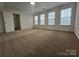 Bright bedroom features plush carpet, neutral walls, and large windows at 2766 Stagbuck Dr, Gastonia, NC 28052