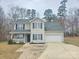 Charming two-story home with a well-manicured lawn, a front porch and an attached garage at 2766 Stagbuck Dr, Gastonia, NC 28052