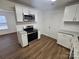 Bright kitchen features stainless steel appliances, granite counters, white subway tile backsplash, and wood-look flooring at 2766 Stagbuck Dr, Gastonia, NC 28052
