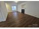 Spacious living room with a fireplace, neutral walls, and wood-look flooring at 2766 Stagbuck Dr, Gastonia, NC 28052