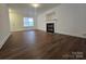 Comfortable living room featuring wood-look floors, neutral walls and a fireplace at 2766 Stagbuck Dr, Gastonia, NC 28052