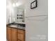 Charming bathroom featuring a marble countertop vanity and neutral wall decor at 2823 Providence Rd # 236, Charlotte, NC 28211