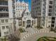 Exterior shot highlighting the condo's entrance, lush greenery, and elegant design at 2823 Providence Rd # 236, Charlotte, NC 28211