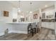 Kitchen area features marble countertops, gray tile backsplash, and modern bar stool seating at 2823 Providence Rd # 236, Charlotte, NC 28211