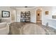 A decorated living room with shelving, trim work, and light-colored, luxury vinyl plank flooring at 2823 Providence Rd # 236, Charlotte, NC 28211