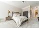 Spacious main bedroom features neutral colors, carpet, and contemporary decor with access to the ensuite at 2823 Providence Rd # 236, Charlotte, NC 28211