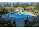 Aerial view of a community pool surrounded by manicured gardens at 2823 Providence Rd # 236, Charlotte, NC 28211