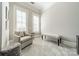 Well-lit sitting room features plush chair and bench seating, neutral walls, carpet and shutters at 2823 Providence Rd # 236, Charlotte, NC 28211