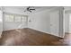 Bedroom with hardwood floors, neutral walls, ceiling fan, and plenty of natural light at 3120 Minnesota Rd, Charlotte, NC 28208