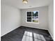 Bright bedroom featuring updated flooring and a large window for natural light at 3212 Irwin Valley Ct, Charlotte, NC 28269