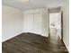 Bedroom featuring updated flooring, ample closet space, and multiple entryways at 3212 Irwin Valley Ct, Charlotte, NC 28269