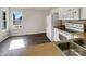 Bright kitchen with white cabinets, stainless sink, and window view at 3212 Irwin Valley Ct, Charlotte, NC 28269