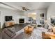 Cozy living room featuring a fireplace, neutral furniture, and a door to outdoor patio at 3212 Irwin Valley Ct, Charlotte, NC 28269