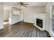 Open floor plan view of living room with fireplace leading to kitchen at 3212 Irwin Valley Ct, Charlotte, NC 28269