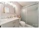 Elegant bathroom featuring marble countertop vanity and a glass-enclosed shower at 3414 Clearview Dr, Monroe, NC 28110