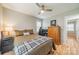 Relaxing bedroom with hardwood floors, a ceiling fan, and warm natural light at 3414 Clearview Dr, Monroe, NC 28110