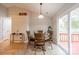 Cozy dining room featuring a wood table with deck access through sliding glass doors at 3414 Clearview Dr, Monroe, NC 28110