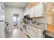 Bright kitchen with white cabinets, granite countertops, and stainless steel appliances at 3414 Clearview Dr, Monroe, NC 28110