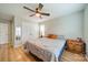 Comfortable main bedroom features hardwood floors, a ceiling fan, and ample closet space at 3414 Clearview Dr, Monroe, NC 28110