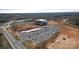 Aerial view of a construction site, highlighting the development's progress, ample parking, and overall scale at 358 Caffee Dr, Kings Mountain, NC 28086