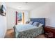 Cozy bedroom featuring a stylish bed with a padded headboard, complemented by natural light from the window at 358 Caffee Dr, Kings Mountain, NC 28086