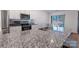 A granite counter space and sink is featured in the kitchen of this house with stainless steel appliances at 358 Caffee Dr, Kings Mountain, NC 28086