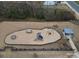 Aerial view of a fenced neighborhood playground featuring a slide, swing, and covered picnic area at 358 Caffee Dr, Kings Mountain, NC 28086