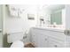 Well-lit bathroom featuring a toilet, vanity with sink and soft decor at 3615 Maple Glenn Ln, Charlotte, NC 28226