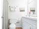 Well-lit bathroom featuring a toilet, shower and a clean vanity with fresh towels at 3615 Maple Glenn Ln, Charlotte, NC 28226