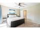 Comfortable bedroom featuring a ceiling fan, a cozy bed, and a convenient doorway access at 3615 Maple Glenn Ln, Charlotte, NC 28226