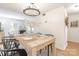 Dining room with chandelier, hardwood floors, and view of the living room at 3615 Maple Glenn Ln, Charlotte, NC 28226