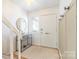 Bright and welcoming foyer featuring an elegant mirror, console table, and ample natural light at 3615 Maple Glenn Ln, Charlotte, NC 28226