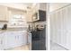 Cozy kitchen featuring granite countertops, white cabinetry, and updated stainless steel appliances and oven at 3615 Maple Glenn Ln, Charlotte, NC 28226