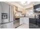 Updated kitchen featuring stainless steel appliances, granite countertops and view to dining room at 3615 Maple Glenn Ln, Charlotte, NC 28226