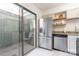 Bright kitchen with stainless steel refrigerator, dishwasher, and sliding glass door to the outside at 3615 Maple Glenn Ln, Charlotte, NC 28226