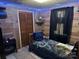 Inviting bedroom featuring wood paneled walls and blue LED accent lighting at 410 Yadkin St, Salisbury, NC 28146