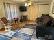 Inviting living room featuring a rustic barn door and comfortable seating at 410 Yadkin St, Salisbury, NC 28146