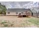 Rear exterior view of home showing deck, vinyl siding, and a spacious backyard at 4205 Ore Bank Dr, Lincolnton, NC 28092