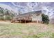 Expansive backyard with a wooden deck and lush green grass at 4205 Ore Bank Dr, Lincolnton, NC 28092