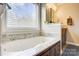 Bright bathroom showcasing a soaking tub with granite countertop at 4205 Ore Bank Dr, Lincolnton, NC 28092