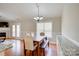 Open-concept dining area with a chandelier and lots of natural light at 4205 Ore Bank Dr, Lincolnton, NC 28092